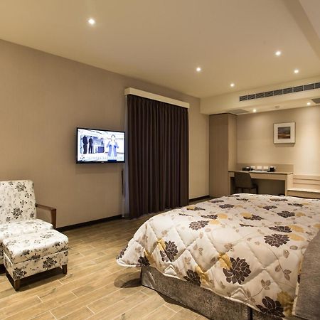 VeryGood Business Hotel Huatan Zimmer foto